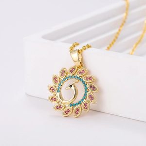 18K gold plated peacock pendant necklace with vibrant pink and teal gemstones