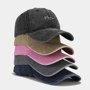 Distressed cotton baseball caps in five colors featuring embroidered Mama text and heart