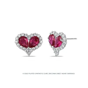 Elegant 18K gold plated heart stud earrings with red cubic zirconia and white stone halo