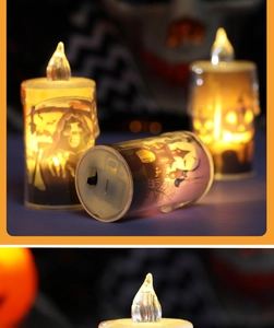 Close-up of Halloween LED candle featuring spooky castle and pumpkin prints