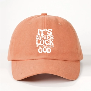 Pink adjustable cotton baseball cap with white IT'S NEVER LUCK IT'S ALWAYS GOD slogan print
