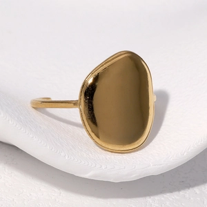 Detail view of gold minimalist open ring featuring a smooth irregular geometric pebble shape