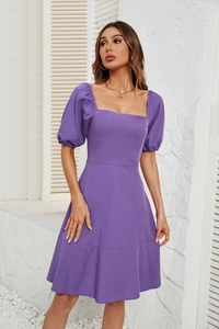 Detail of square neckline and puff sleeves on a purple high-waist summer dress