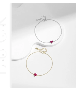Macro detail of S925 sterling silver bracelets with red heart-shaped zircon stones