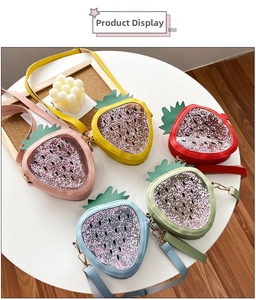 Detail of strawberry shaped glitter crossbody bags for kids with floating sequins