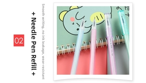 Close-up of needle-point gel pens in macaron colors on a cute dinosaur notebook