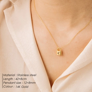 Close-up of golden letter C padlock necklace on model with 42+8cm chain length specs