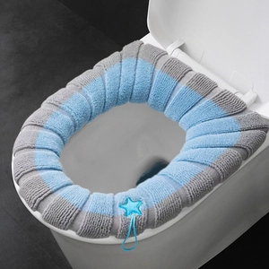 Warm knitted striped toilet seat cover in blue and gray with star embroidery detail