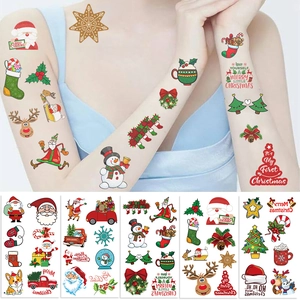 Detailed view of waterproof Christmas temporary tattoos featuring Santa, reindeer and snowman