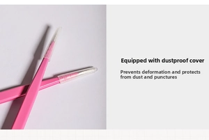 Detailed macro view of pink stainless steel tweezers with protective cap for nail art