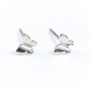 Minimalist silver butterfly stud earrings for women with a sleek metallic luster finish