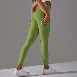 Close-up of high-waisted seamless green yoga leggings with peach butt lifting effect