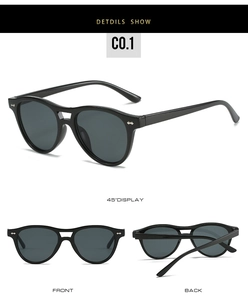 Detail view of oval double bridge sunglasses with metal rivets on black frames
