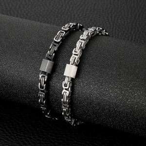 Silver-colored Byzantine king chain bracelet for men in stainless steel on black stands