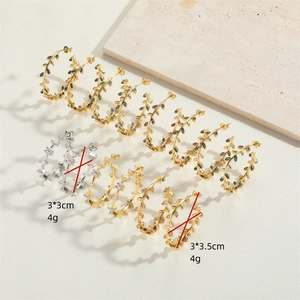 Exaggerated 14K gold leaf stud earrings with colorful crystals and dimensions