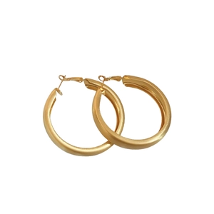 Matte gold brushed wide hoop earrings with silver pins in minimalist retro style