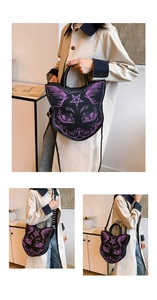 Close-up of gothic black cat crossbody bag featuring a purple feline print and star detail
