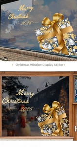 Detail of gold 2026 Merry Christmas window stickers with bow and snowflake motifs