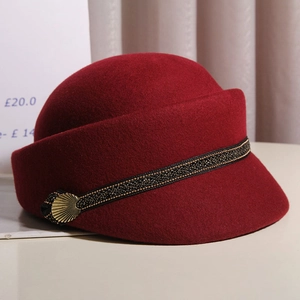 Deep red wool felt beret equestrian hat with gold buckle and black woven band detail