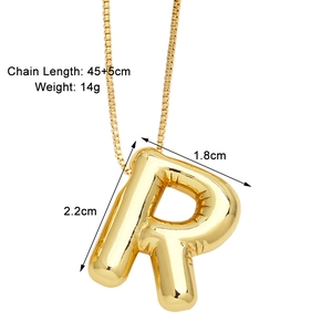 Detail view of gold puffy letter R pendant necklace with dimensions 2.2x1.8cm