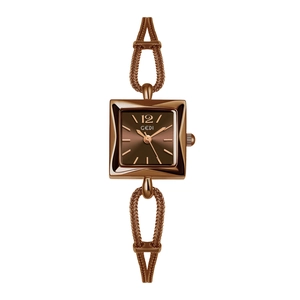 Close-up of GEDI rose gold square watch featuring a woven metal strap and clear dial