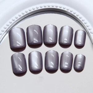 Short square grey purple cat-eye press-on nails with shimmering magnetic finish on mirror