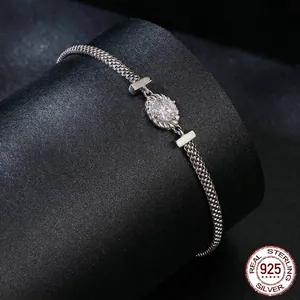 S925 sterling silver braided mesh bracelet featuring a brilliant round moissanite center