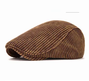 Detailed view of vintage khaki knitted ivy cap showing ribbed texture and classic profile