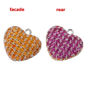 Front and rear views of heart-shaped pendants with pave-set orange and pink zircons