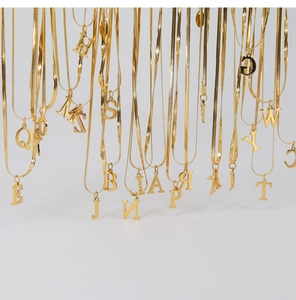 Flat snake chain necklaces with various 18K gold-plated letter pendants from A to Z