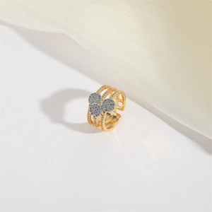 Detail of gold layered hollow ring featuring sparkling pave-set zircon clusters