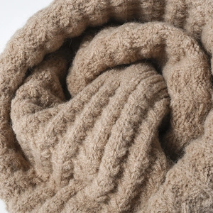 Thick camel ribbed knit beanie for winter, warm wool texture detail in close-up view