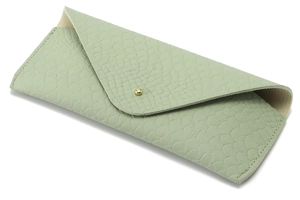 Detail of sage green faux crocodile leather eyeglass case with gold button closure