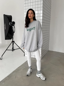 Oversize grey crewneck sweatshirt with Legacy lettering and drop shoulders on model