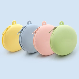 Set of four colorful macaron silicone mini coin purses with zipper and loop keychains