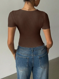 Rear view of brown slim fit V-neck tank top in soft fabric paired with blue jeans