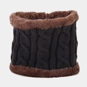 Close-up of cable knit neck warmer with thick brown faux fur lining and charcoal yarn