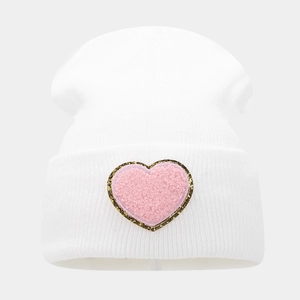 White knit beanie for women with a pink heart patch and shimmering gold sequin trim