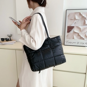 Black quilted down tote bag for women featuring large capacity and minimalist design