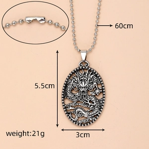 Macro detail of vintage punk dragon pendant with dimensions 5.5cm by 3cm and 60cm chain