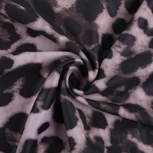 Close-up of leopard print fabric detail with ruffled texture and brown leopard pattern