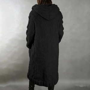 Detail of black chunky knit long cardigan with hood and ribbed cuffs on the back view
