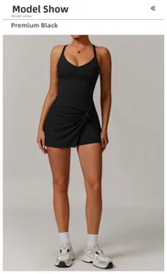 Detail of premium black tennis dress featuring a twist knot hem and V-neck design