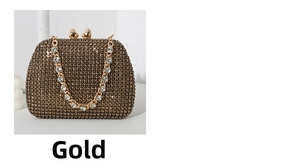 Close-up of gold rhinestone evening clutch bag with heart-shaped metal clasps and chain