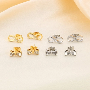 Elegant infinity and bow knot stud earrings set in gold and silver with zircon stones