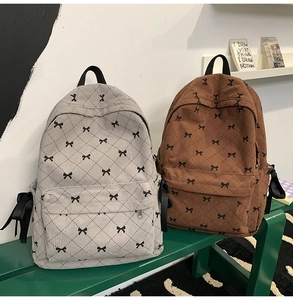 Corduroy backpacks in grey and brown featuring ribbon bows and checkered pattern