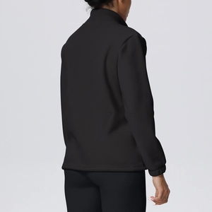 Detail view of the black fleece sports jacket showing the elastic cuffs and slim fit cut