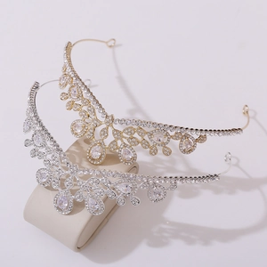 Elegant silver and gold bridal crowns with sparkling zircons for wedding hairstyles
