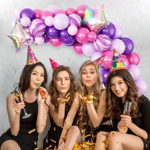 Pink and purple party balloon arch set with marble balloons and happy birthday hats scene
