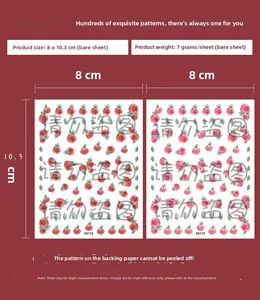 Detail view of thin floral nail stickers with red rose designs for manicure art